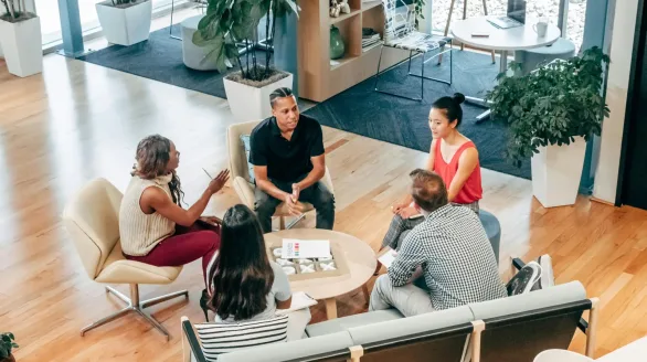 pexels-photo-7688173-7688173 A diverse group of professionals engage in a collaborative team meeting in a stylish office environment.